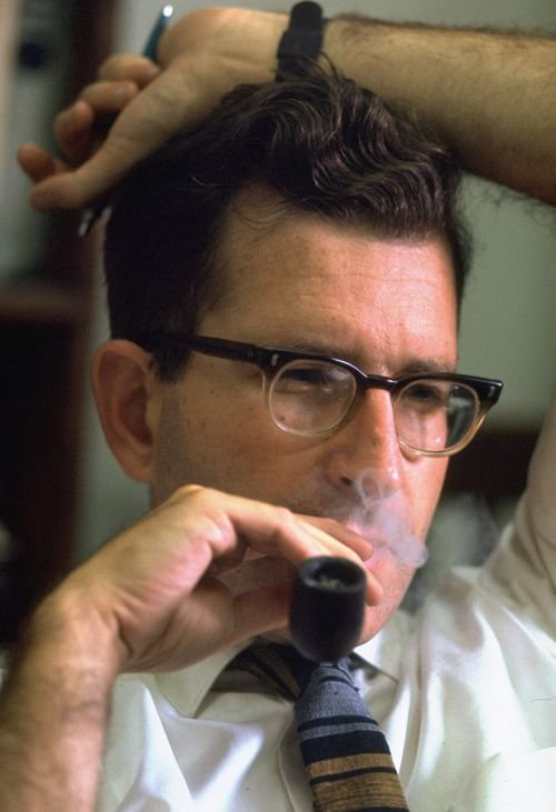 A young Noam Chomsky smoking a pipe.