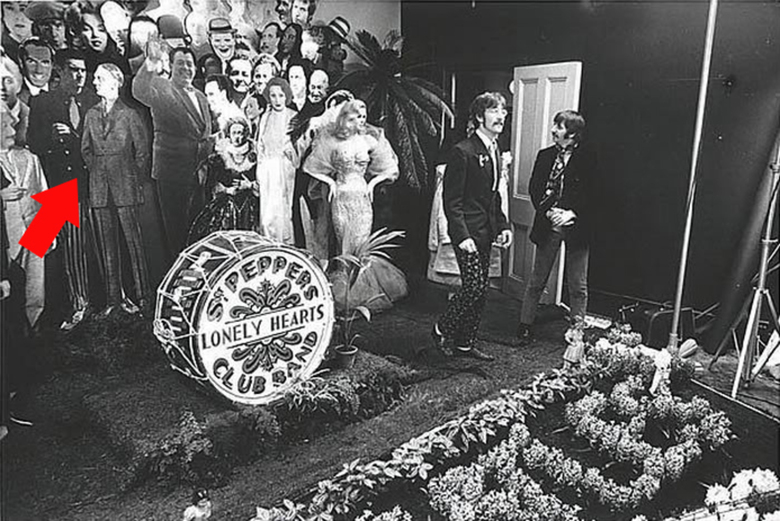 An outtake from the Sgt. Pepper cover shoot with an arrow indicating Adolf Hitler’s cutout.