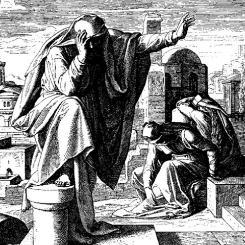 A woodcut of a grieving figure before a desolate city.
