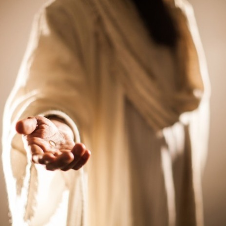 An open hand with a wound in the palm reached toward the viewer.